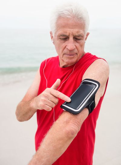 Senior man listening to music on his phone