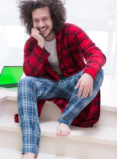 freelancer in bathrobe working from home