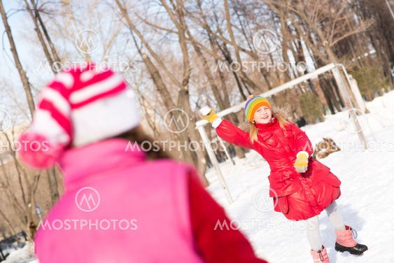 Children in Winter Park playing snowballs