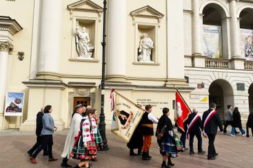 Traditional cultural procession outside a historic...