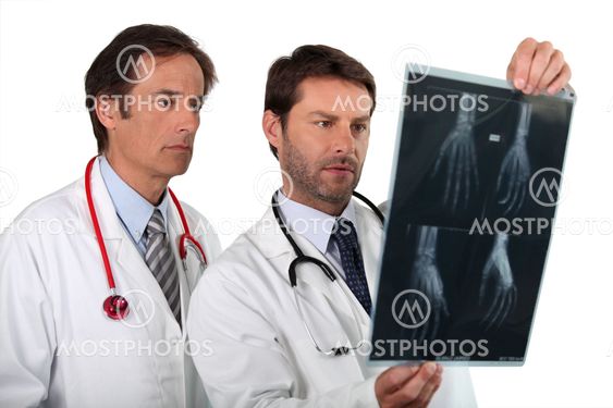 Doctors examining x-ray