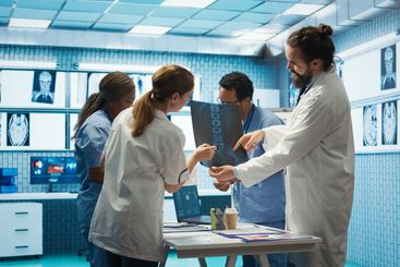 Doctors analyze human anatomy scans in a treatment center