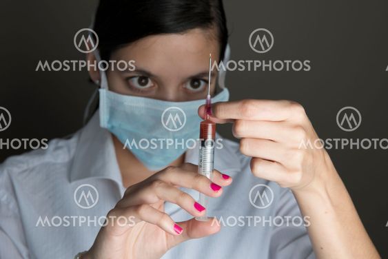 Beautiful women holding syringe