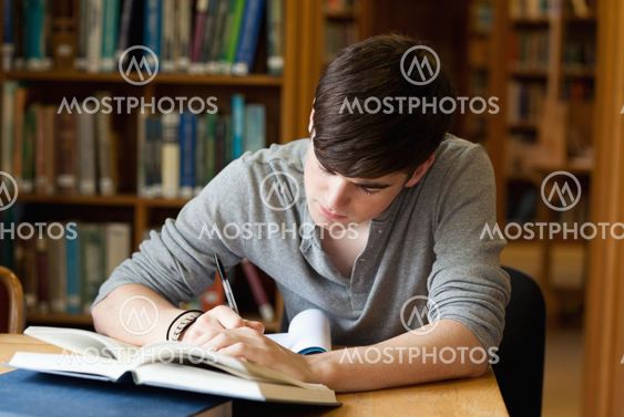 Focused male student working