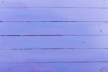 Soft lavender wooden planks arranged in parallel lines...