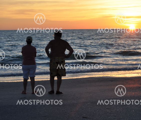 SENIOR COUPLE IN SUNSET
