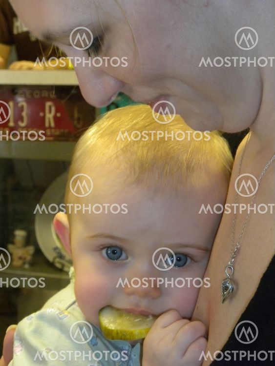 Baby eating pickle