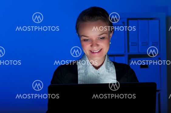 portrait of a woman in a night office
