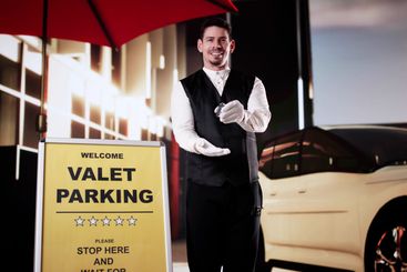 Portrait Of A Handsome Male Valet Holding Car Keys