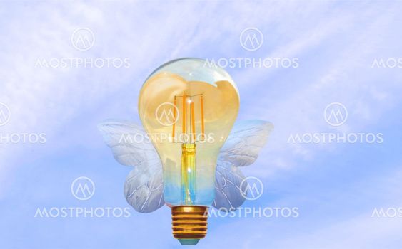 Realize your ideas and dreams. Flying light bulb.