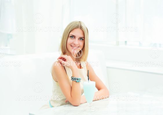 portrait of a beautiful woman in the cafe