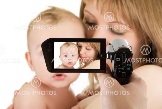 mother with her baby boy at camcorder