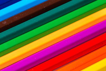 Colorful arrangement of art supplies with various shades...