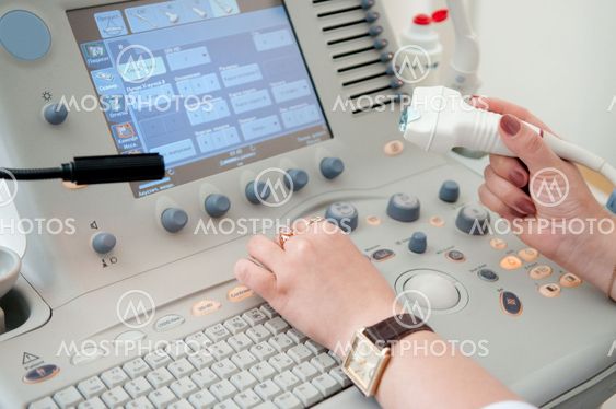 medical doctor during ultrasound investigation