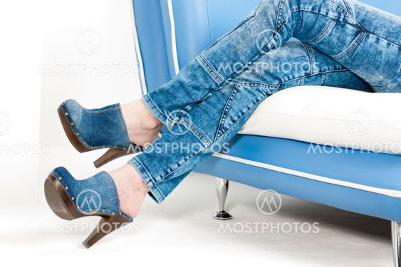 detail of woman wearing denim clogs