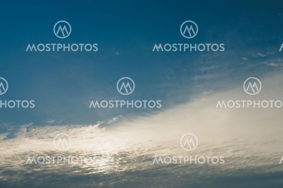 Cirrus and cirrocumulus clouds covering morning sun and sky