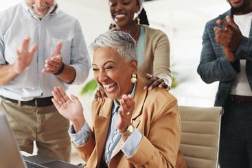 Woman, team and throw paper for celebration with...
