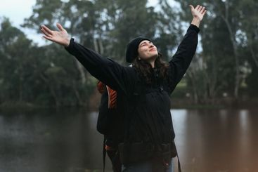 Hiking, celebration and woman with freedom in nature for...