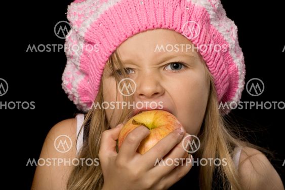 little girl eating apple