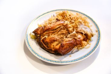 Chicken with biryani, the traditional Asian dish of...