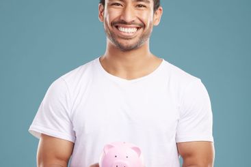 Studio, man and portrait with smile for piggy bank,...