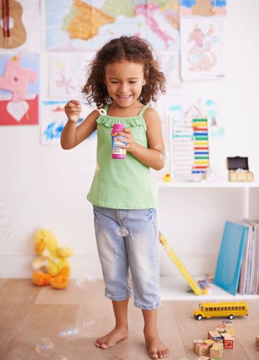 Playing, kid and blowing bubbles with toys for childhood...