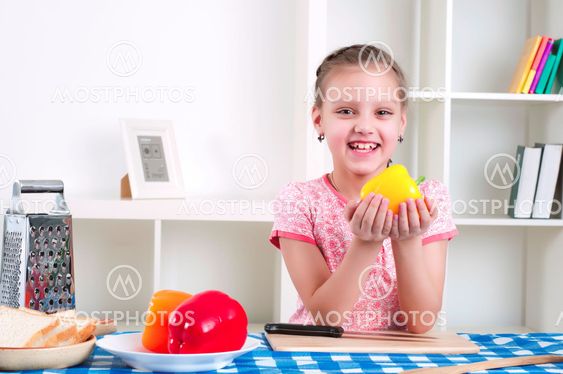 girl working in the kitchen cutting vegetables