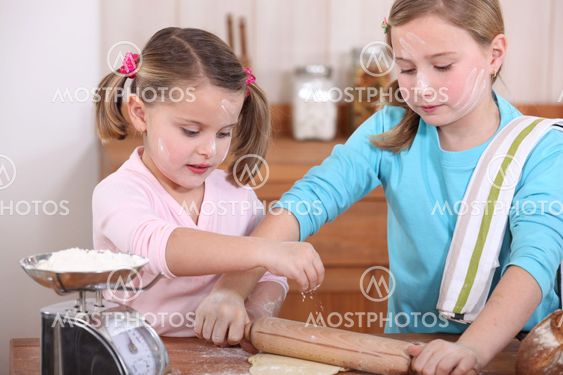 Two little girls baking