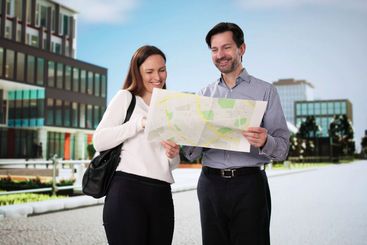 Smiling Tourists Explore City with Map