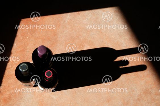 Wine Bottles with Dramatic Shadow