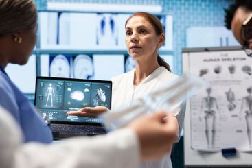 Radiologists doctors analyzing cardiology scans to...