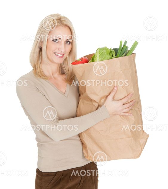 Beautiful woman with grocery bag