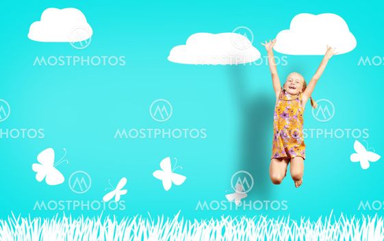 Girl jumping in a color dress