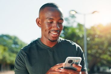 Outdoor, black man and fitness with smartphone for chat,...