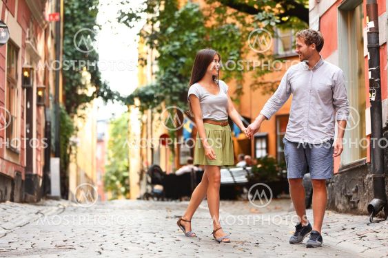 Happy couple in love walking in Stockholm city