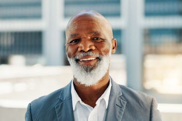 Business, building and portrait of black man in city for...
