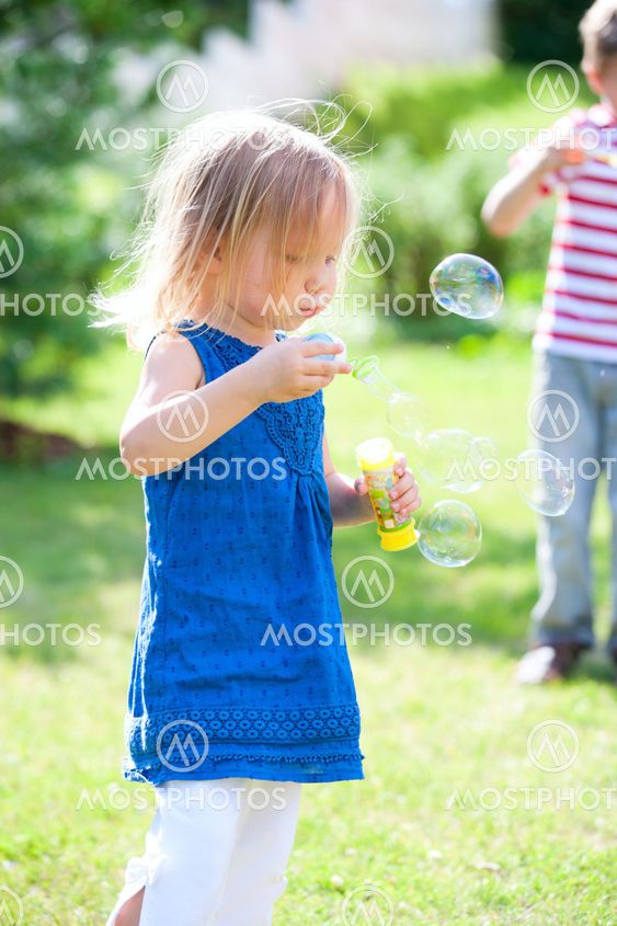 Blowing soap bubbles
