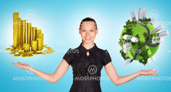 Businesswoman holding coins and earth globe