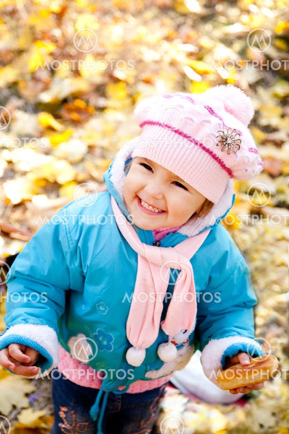 Cute girl in autumn park