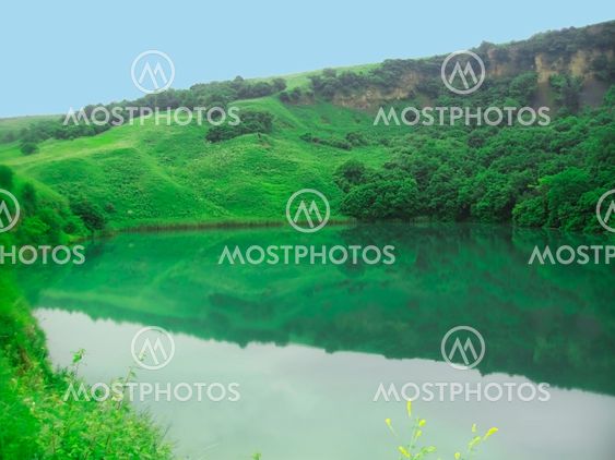 Small lake between the caucasus mountains summertime