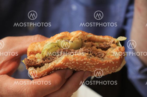 Man holding a hamburger