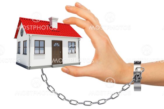 Chained hand holding house
