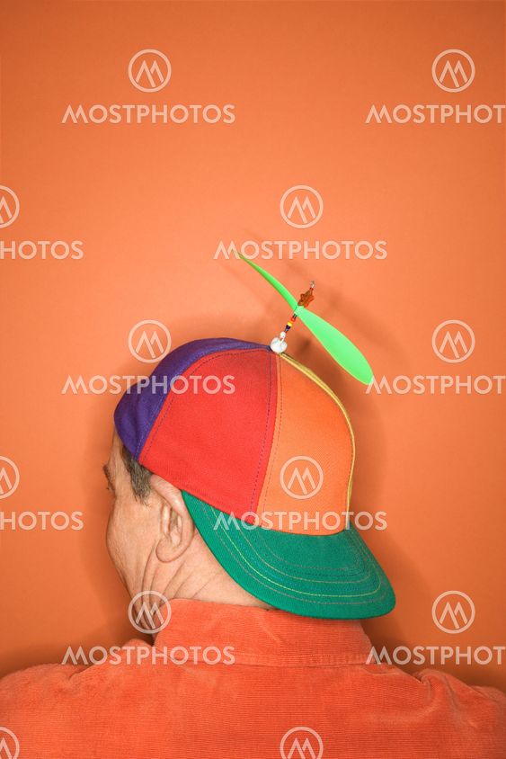 Man wearing propeller hat.