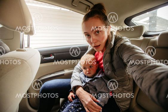 Mother and her baby in car