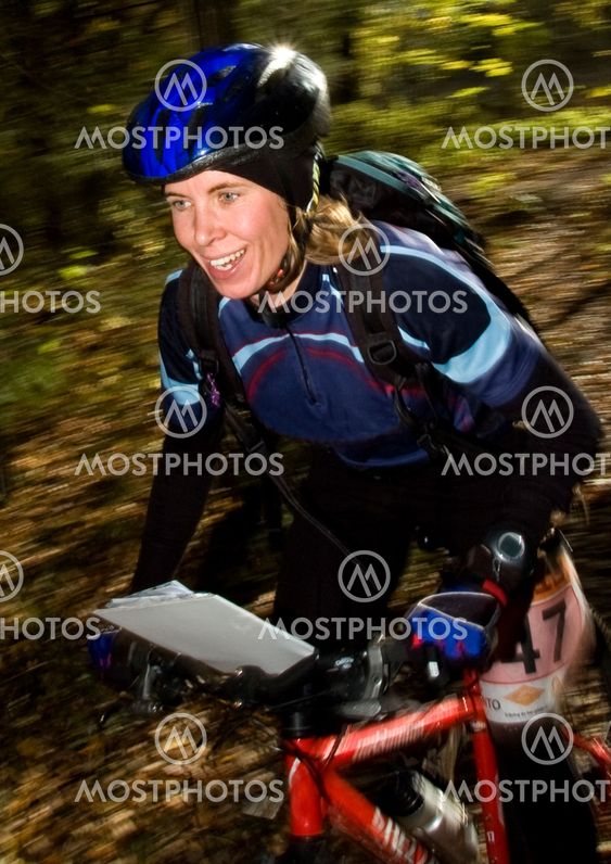 Girl racing on mountain bike