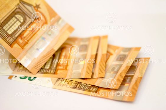 Fifty euro banknotes spread out isolated on white
