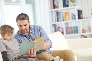 Education, learning or reading with father and son on...