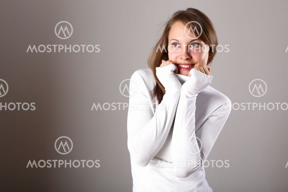 Young girl in white sweater