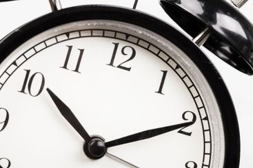 Close up of a black vintage alarm clock