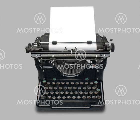Antique typewriter with paper, isolated